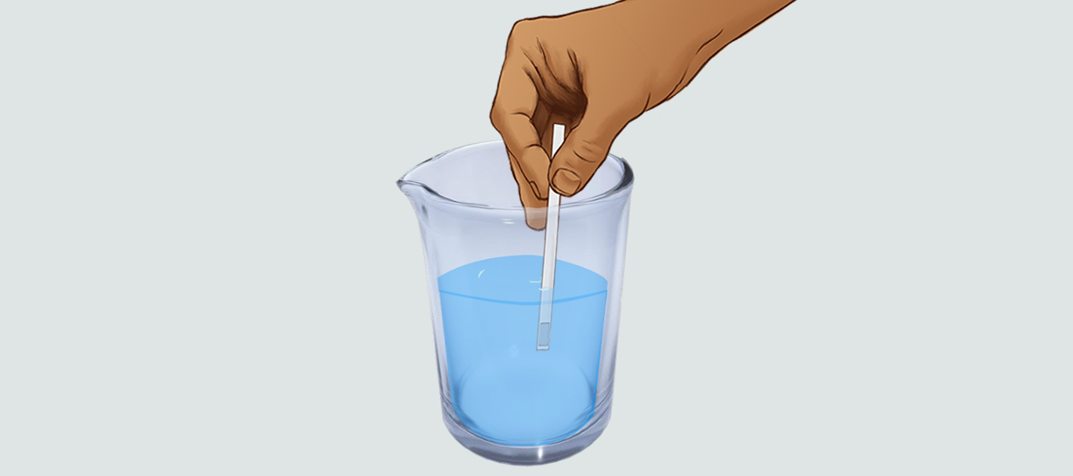 Hand stirring the water in a cup for Test Strip Lab Iteractive